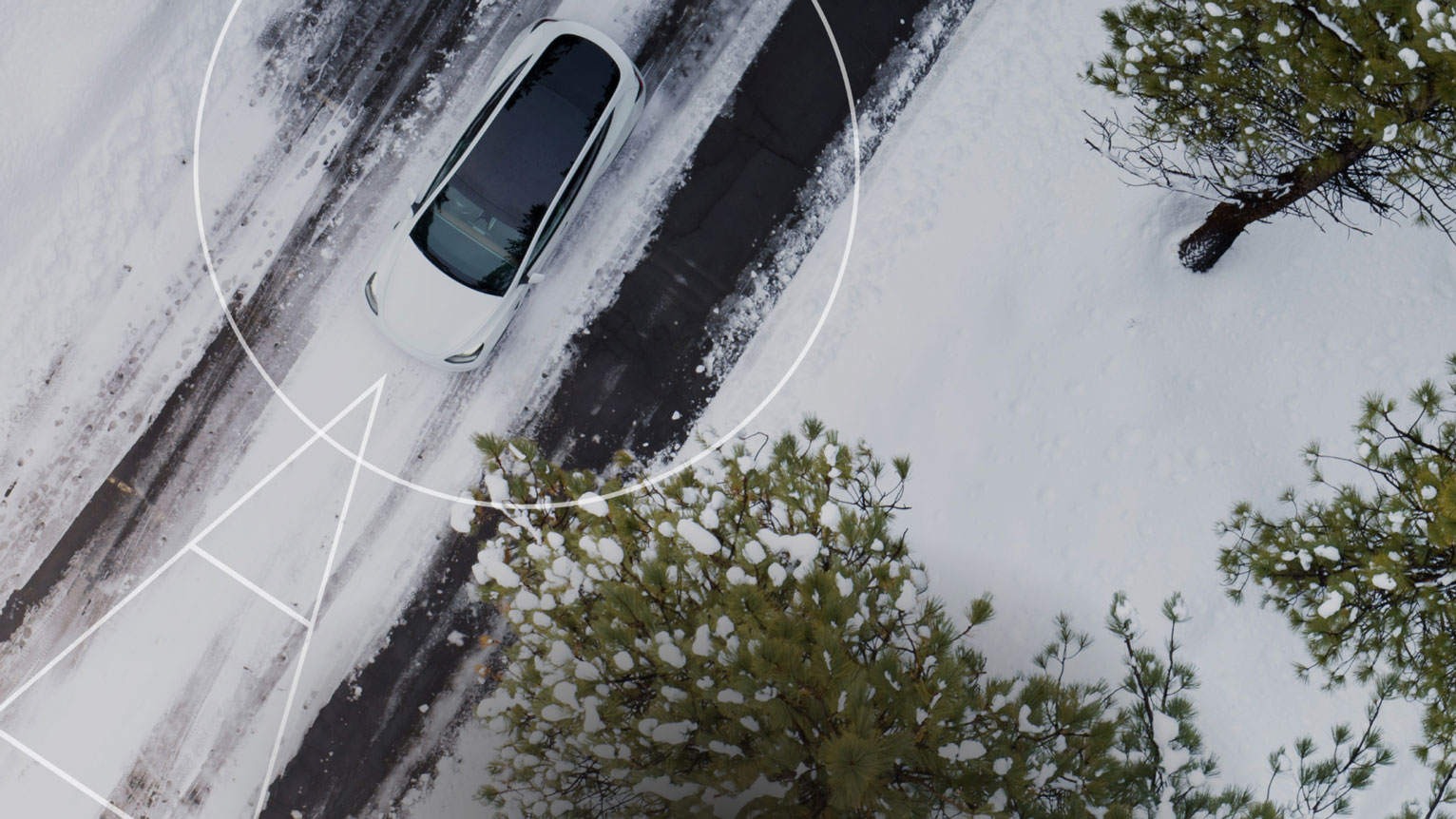 Car-shared Tesla through the Teneo app on a road in a snowy landscape